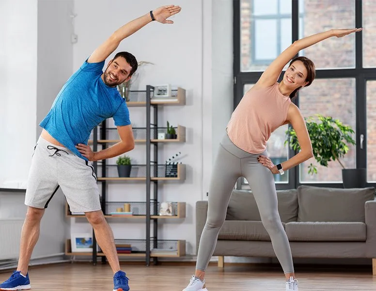 Man and woman stretching and exercising